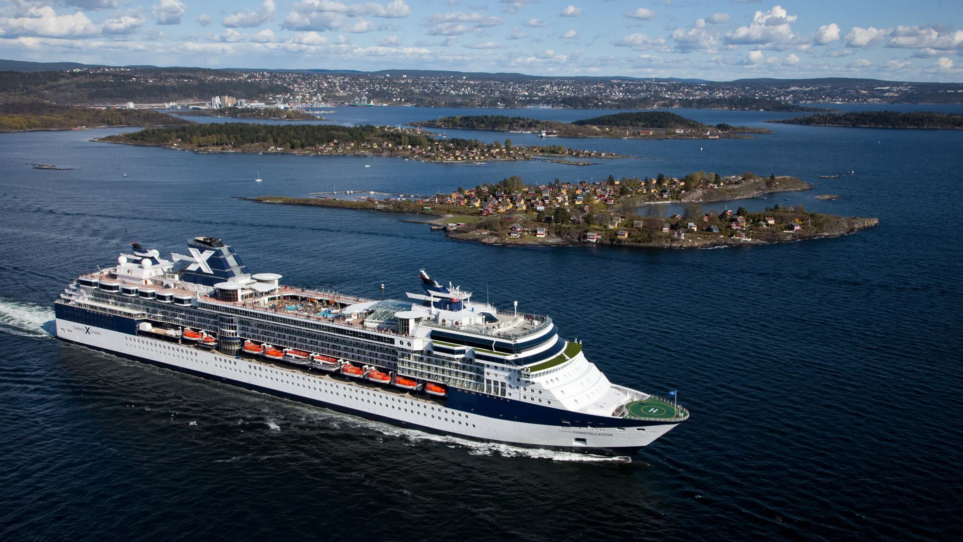 Celebrity Constellation sailing past the islands and shoreline of Oslo