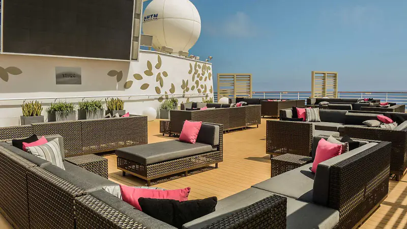Rooftop Terrace seating and movie screen aboard Celebrity Constellation