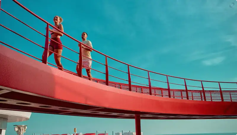 Sailor running on Resilient Lady's outdoor track above the sea