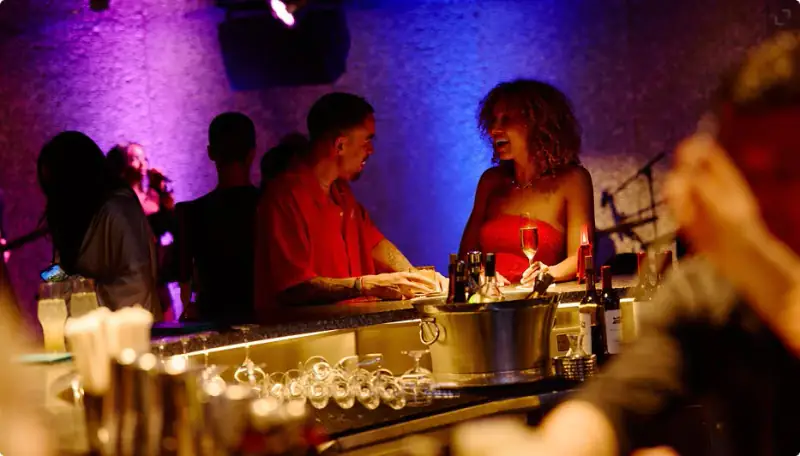 Sailors socializing at a nightlife bar aboard Valiant Lady