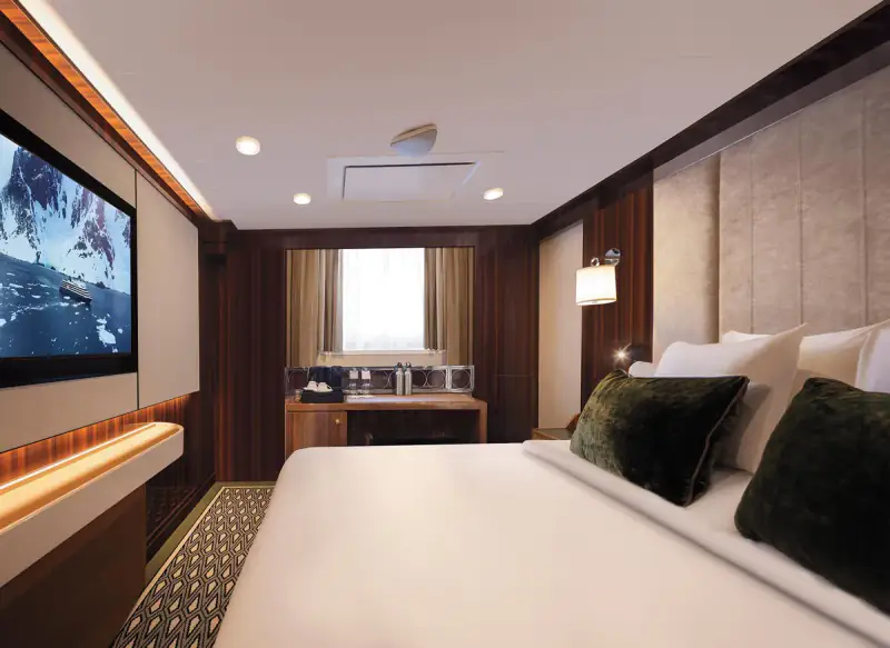 World Navigator Adventure Ocean Suite with bed and picture window