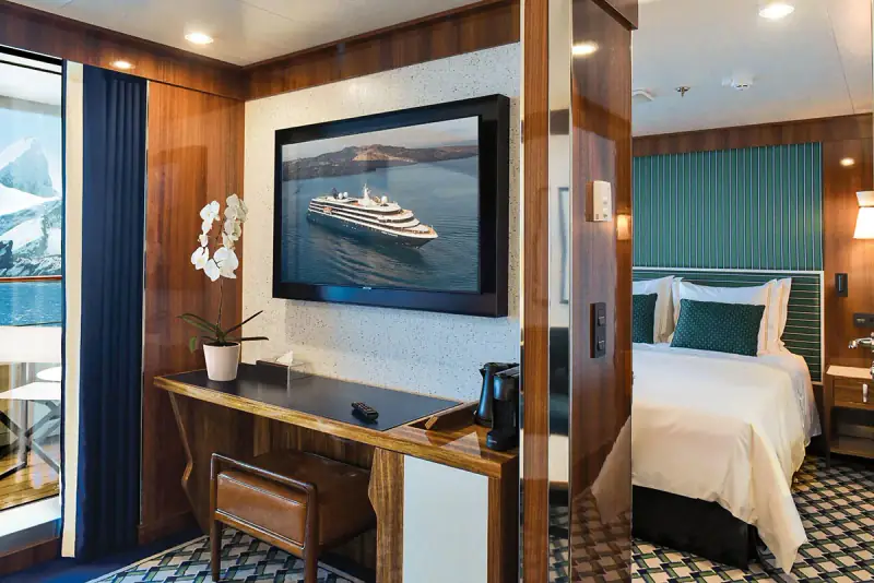 World Traveller Navigator Suite living area looking toward its bedroom and veranda