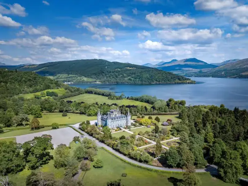 Inveraray Castle sits beside a Scottish loch.