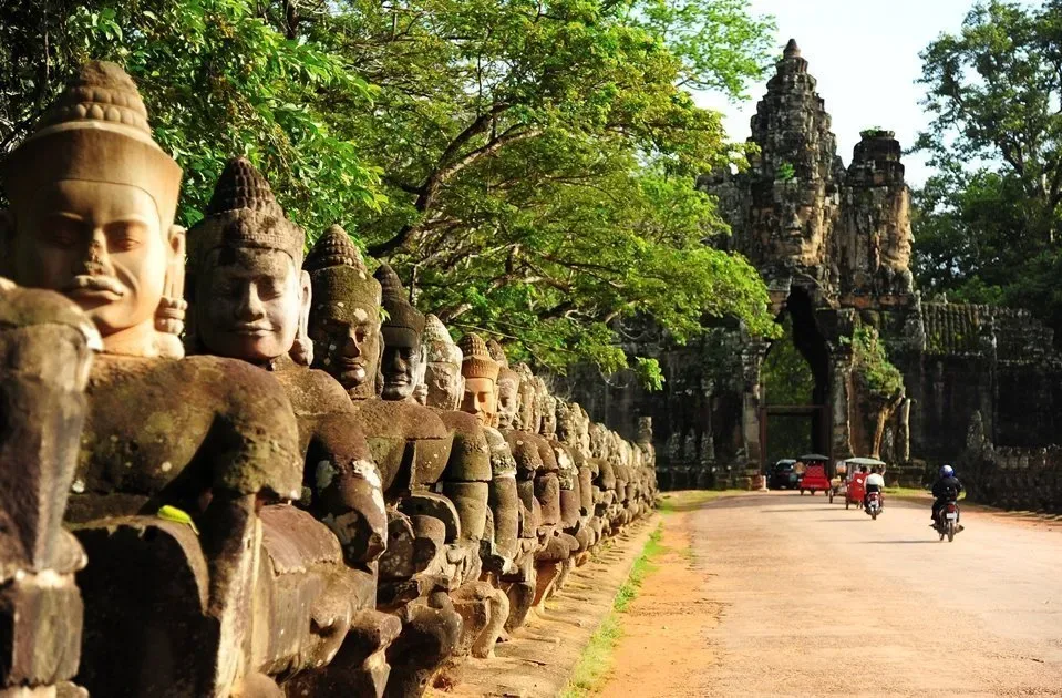 Tree roots frame the entrance to Angkor Thom in Cambodia.