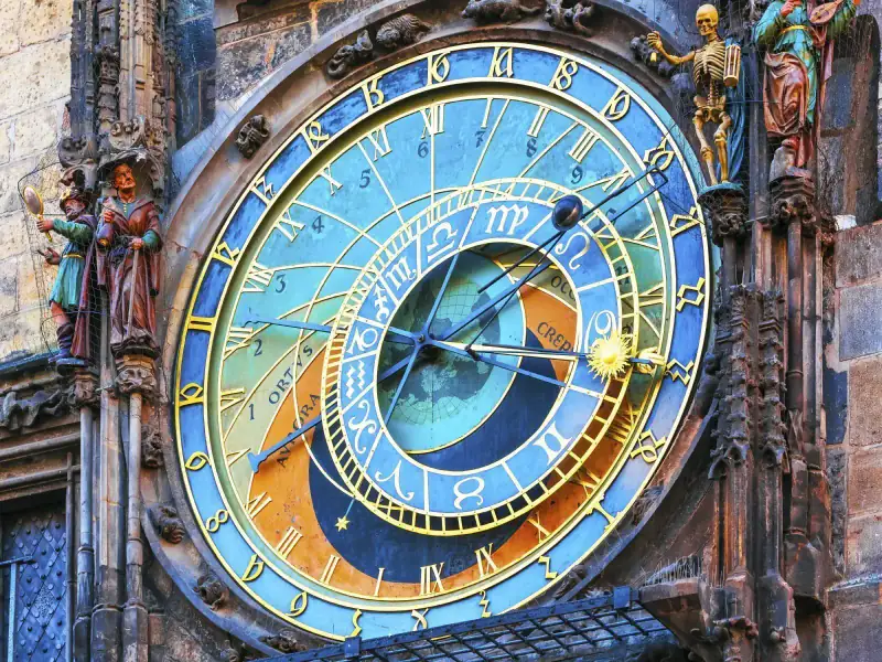 Prague's astronomical clock fills a close-up architectural view.
