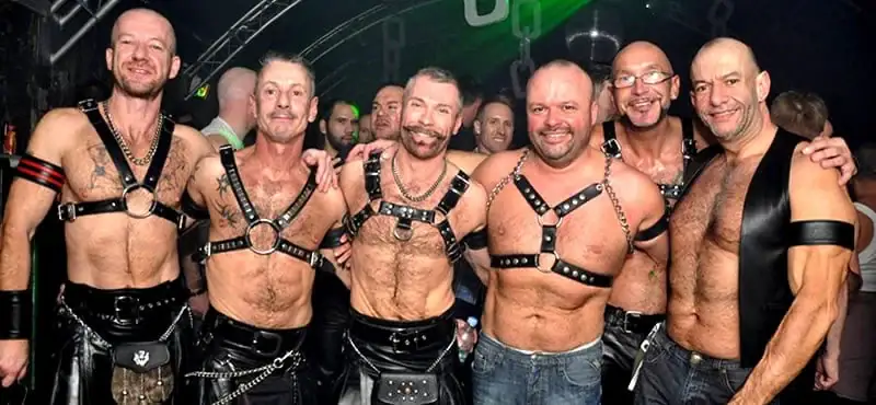 Gruff Cruises guests pose together at an evening social event.