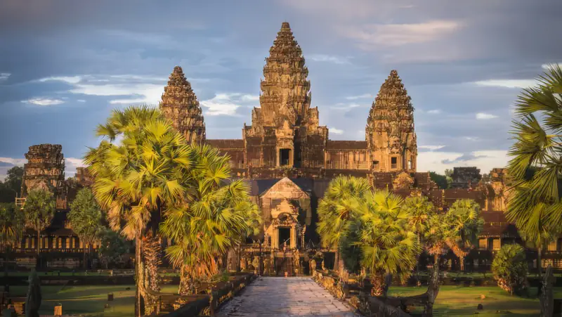 Angkor Wat towers rise above trees in Cambodia.