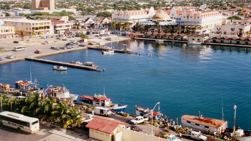 Oranjestad inner harbor and colorful Aruba waterfront seen from a ship