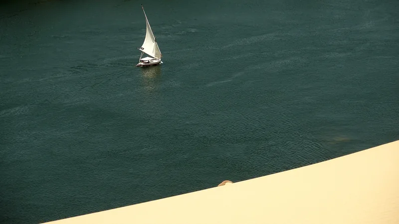 A lone felucca sailing across the Nile at Aswan