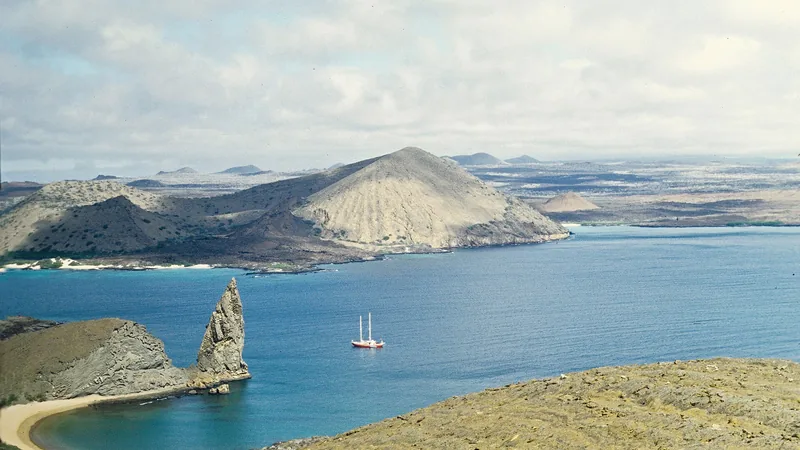Pinnacle Rock and the volcanic shore of Bartolomé Island