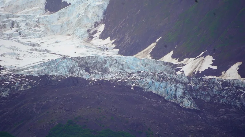 Vassar Glacier descending between the mountains of College Fjord