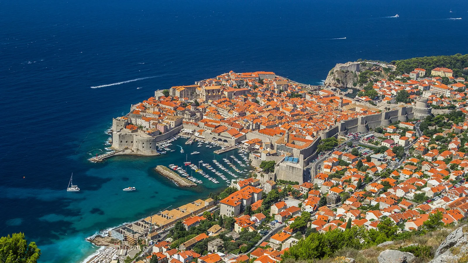 Dubrovnik Old Town, fortress walls, marina, and Adriatic Sea