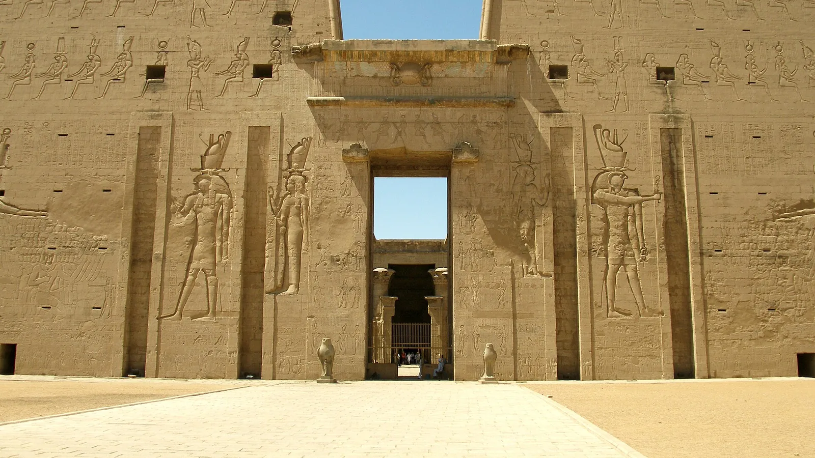 Sandstone pylons and carved reliefs at the Temple of Horus in Edfu
