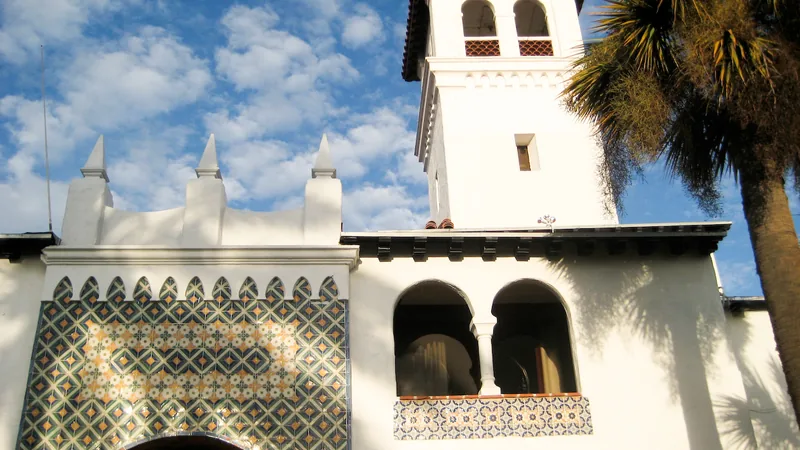 Spanish Colonial facade and palms at Riviera del Pacifico in Ensenada