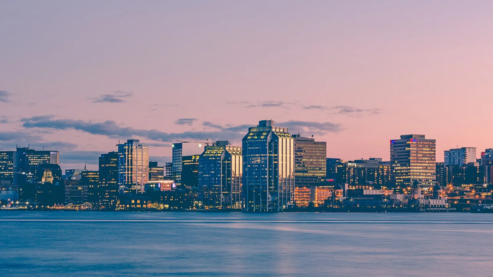 Halifax harbor skyline glowing pink at sunset