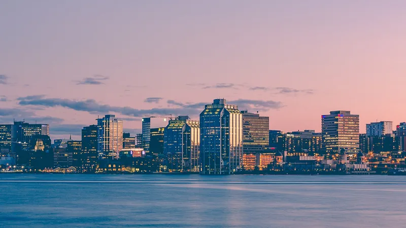 Halifax harbor skyline glowing pink at sunset