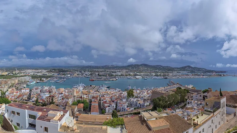 Panorama of Ibiza Town, its harbor, and blue Mediterranean water