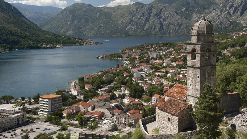 Kotor Old Town, church, bay, and steep mountains