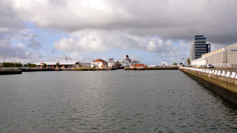 Harbor basin, quays and port buildings in a historic Le Havre photograph; not an assigned charter berth