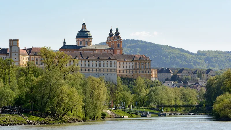 Melk Abbey rising above the Danube and the mouth of the Melk River