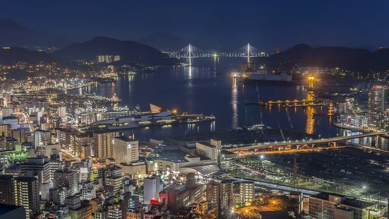 Nagasaki harbor and hillside city lights reflected at night