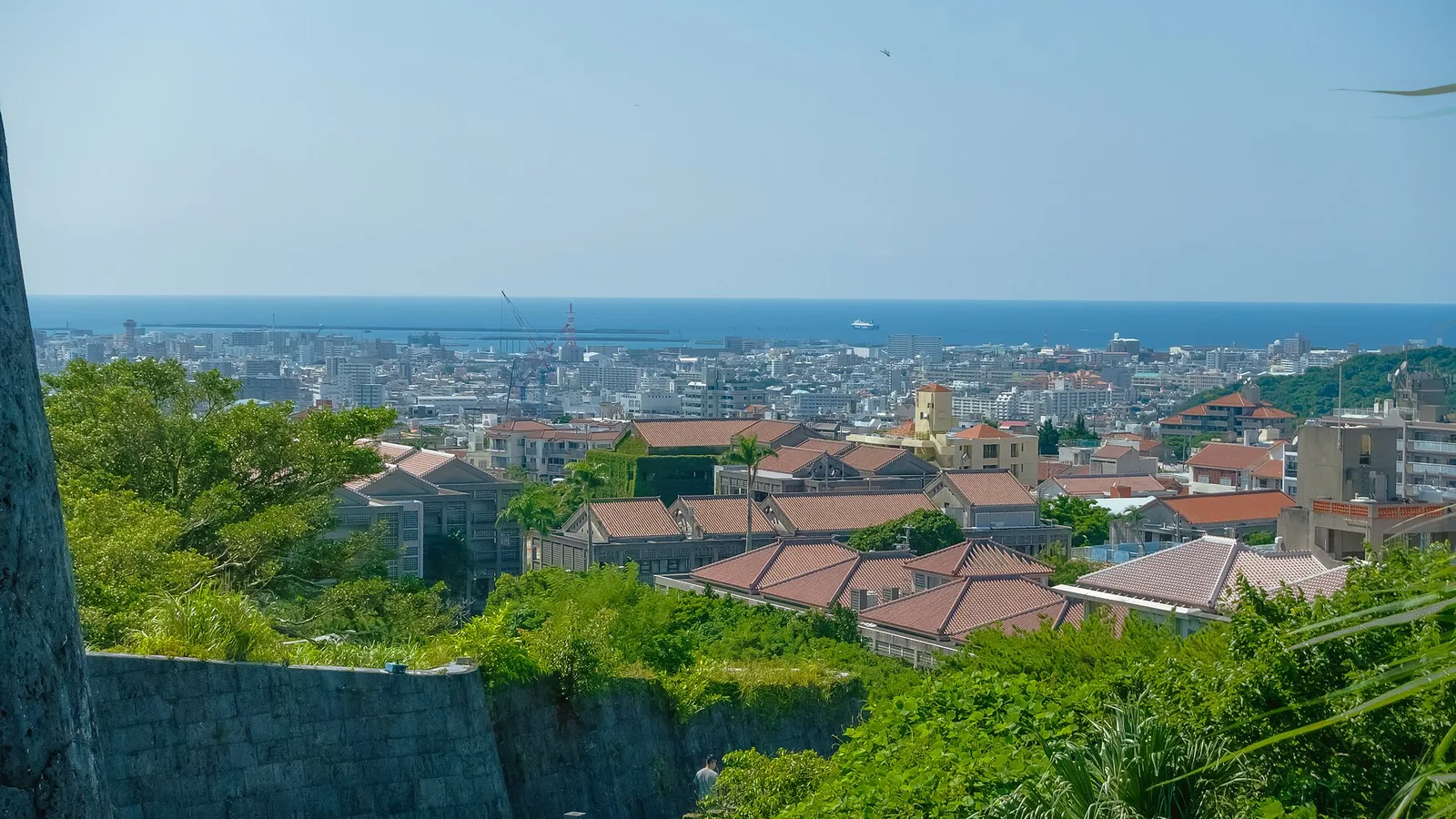 Naha city skyline seen from Shurijo Castle Park in 2024; destination context, not a cruise berth
