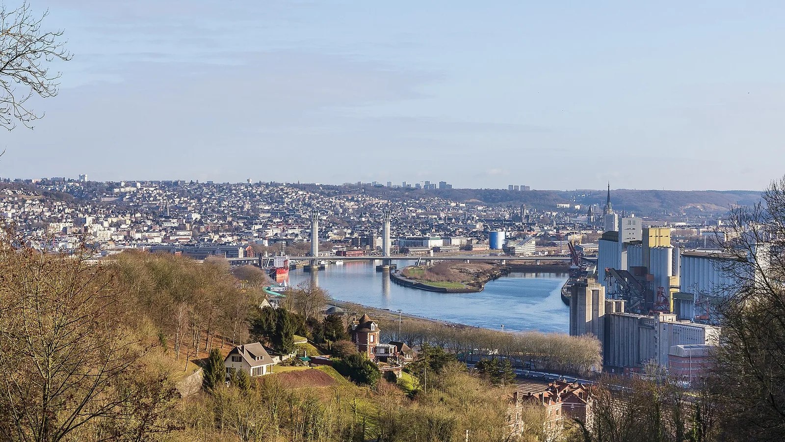 Rouen cityscape, Seine river bend, Pont Gustave Flaubert and harbor structures in a historic panoramic photograph; not an assigned charter quay