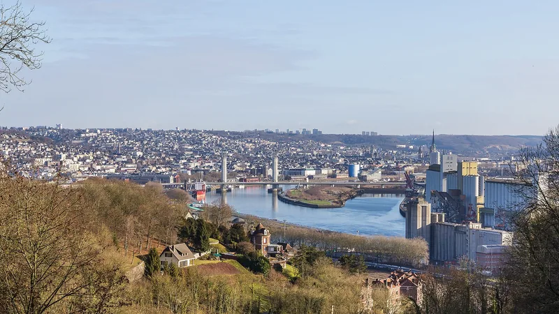 Rouen cityscape, Seine river bend, Pont Gustave Flaubert and harbor structures in a historic panoramic photograph; not an assigned charter quay