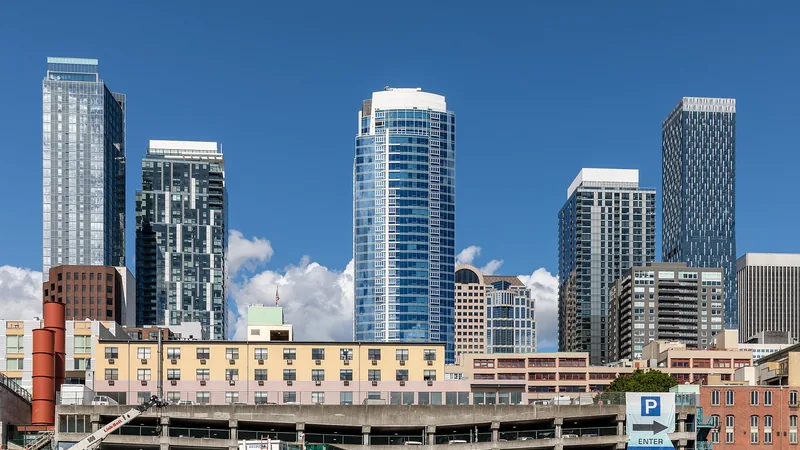 Modern Seattle skyline beneath a clear blue sky