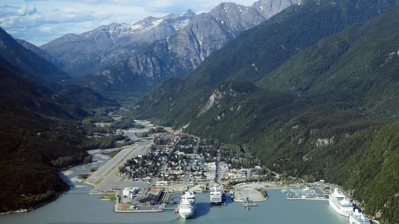 Aerial view of Skagway, its cruise harbor, and mountain valley