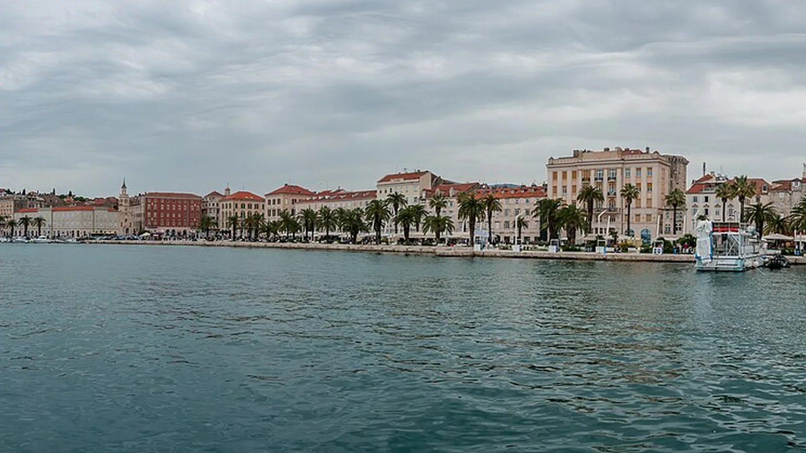 Split's palm-lined Riva waterfront seen across the harbor