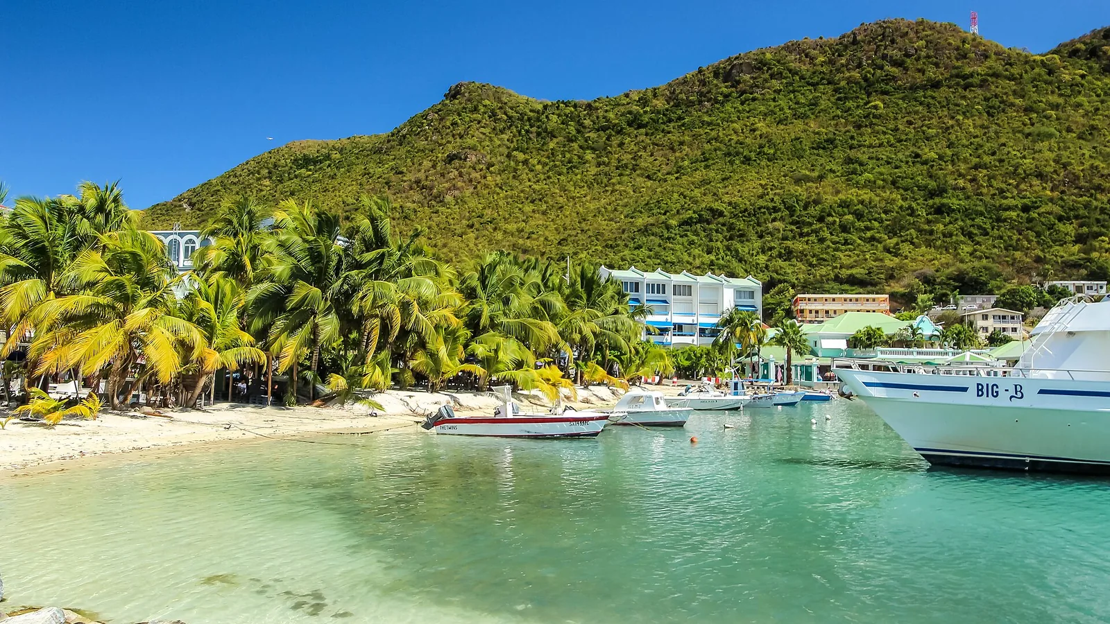Great Bay Beach, Philipsburg waterfront, and green hills in St. Maarten