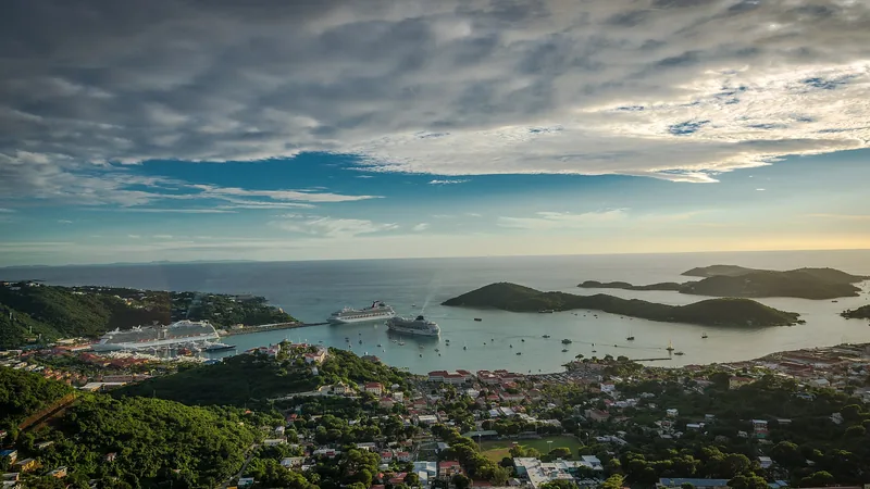 Charlotte Amalie harbor, green hills, and islands under dramatic clouds
