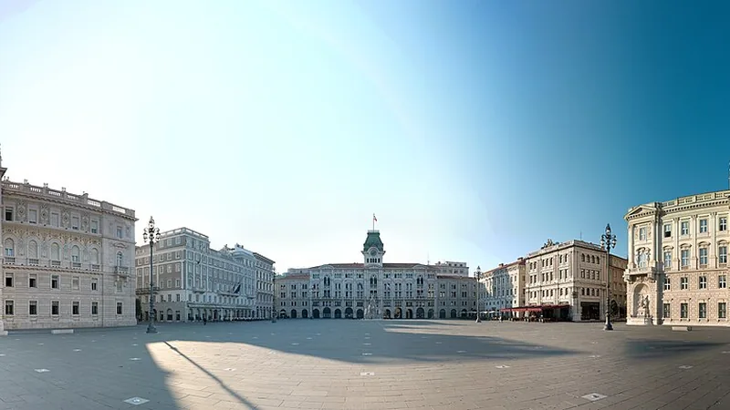 Piazza Unità d'Italia in Trieste beneath a clear morning sky