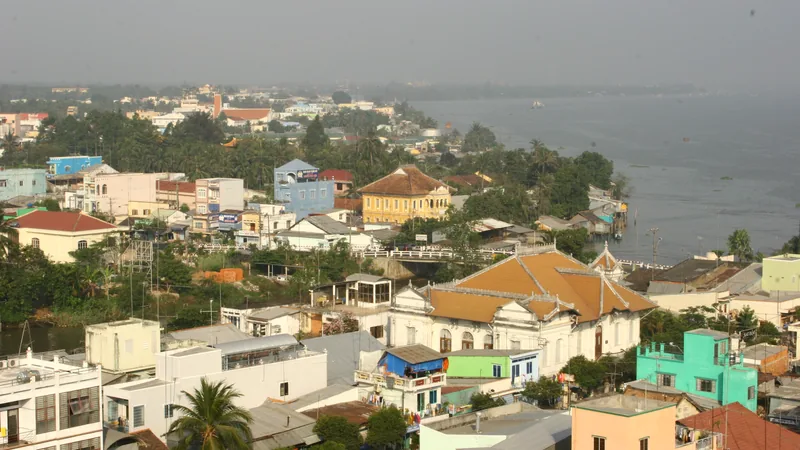 Historic 2007 view across Vĩnh Long rooftops toward the river, illustrating the town rather than a current cruise berth
